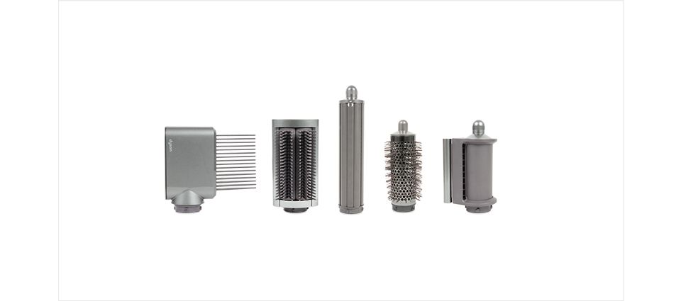 Fünf Original Dyson Zubehörteile in einer Reihe
