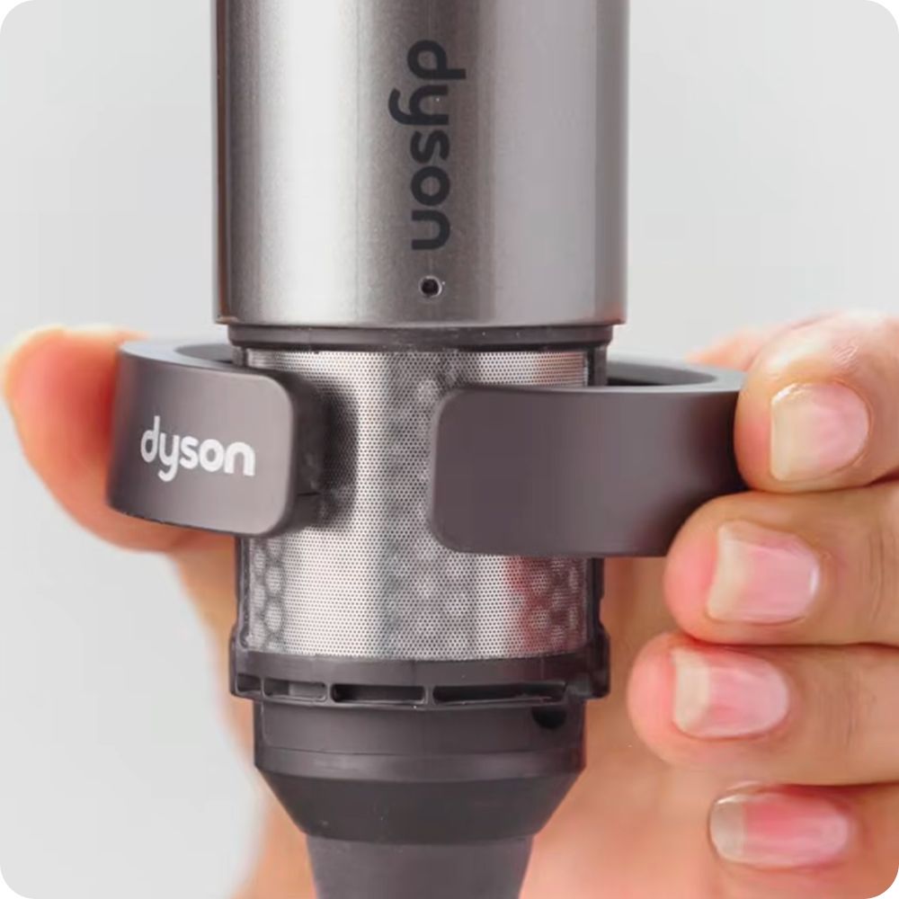 The Dyson Airwrap multi-styler filter is cleaned.
