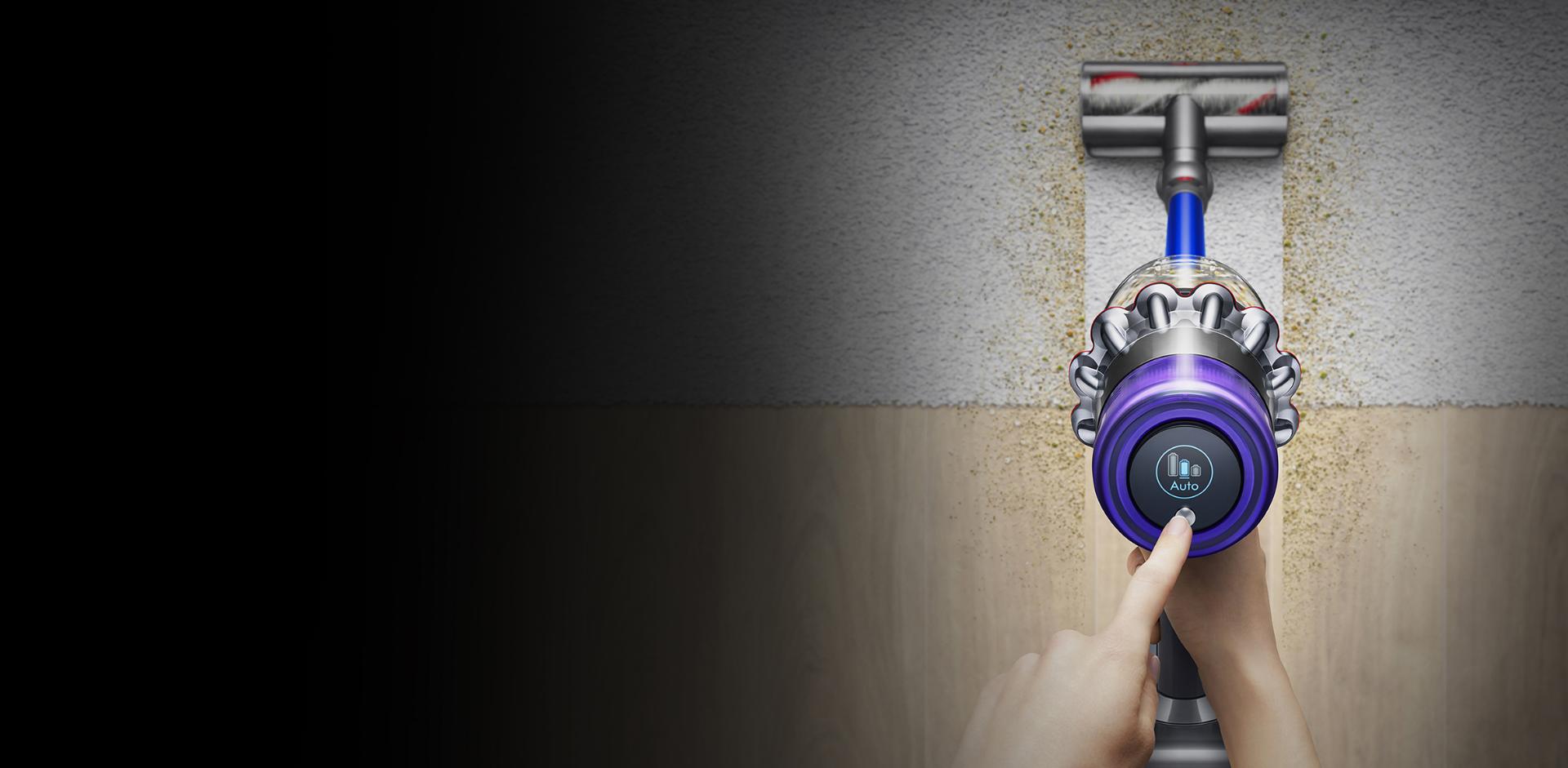 Dyson V11 vacuum cleaner vacuuming up dust from the carpet