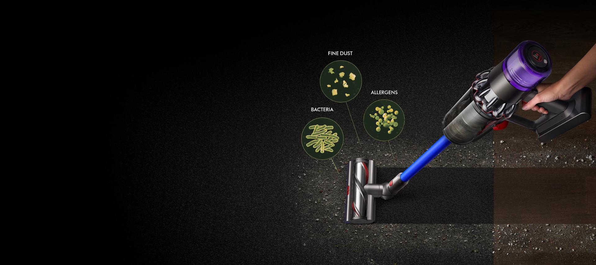 A Dyson V11™ vacuum picking up fine dust, allergens and pollen from the floor.