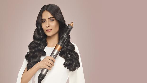 Model wearing Curly blow out style