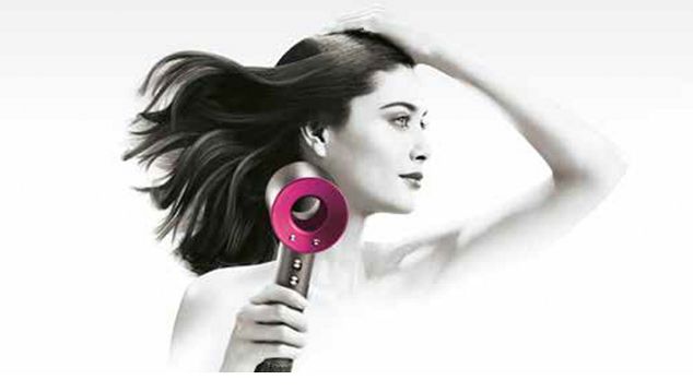 Model using Dyson Supersonic hair dryer