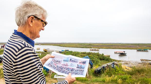 James Dyson holding a copy of the 1957 Eagle a
