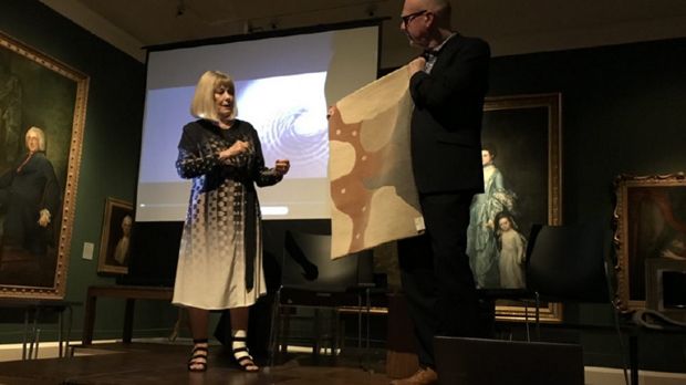 Deirdre Dyson giving a talk about the rugs she designs