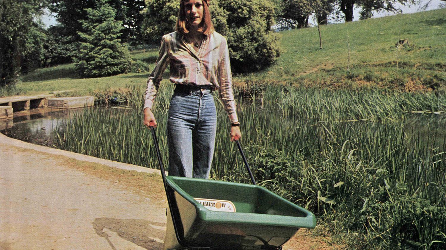 Deidre using the Ballbarrow on a garden path.