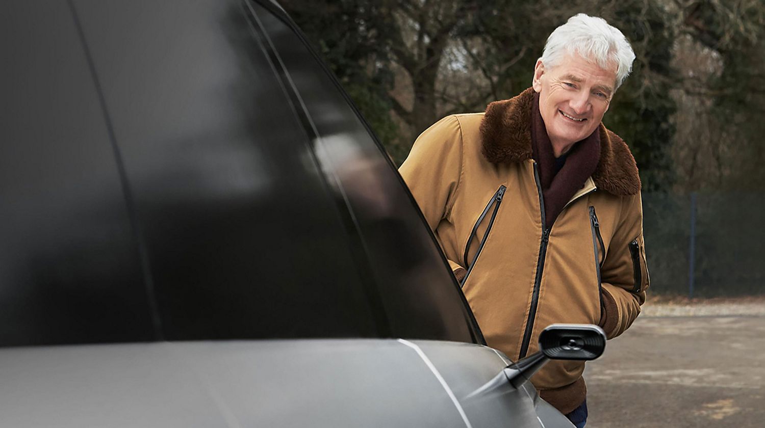 James smiling as he looks at the Dyson Battery-Electric Vehicle.