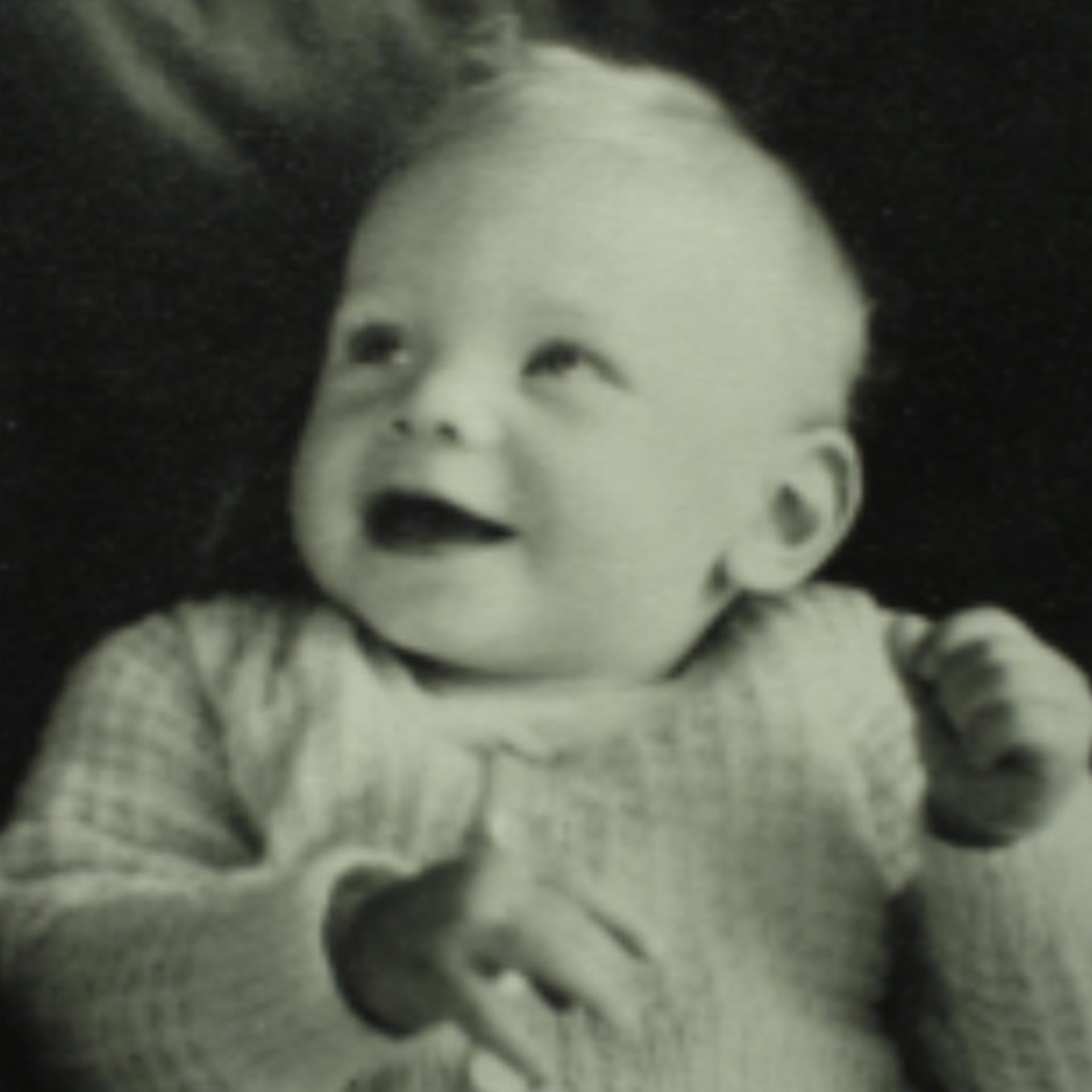 An infant James Dyson smiling