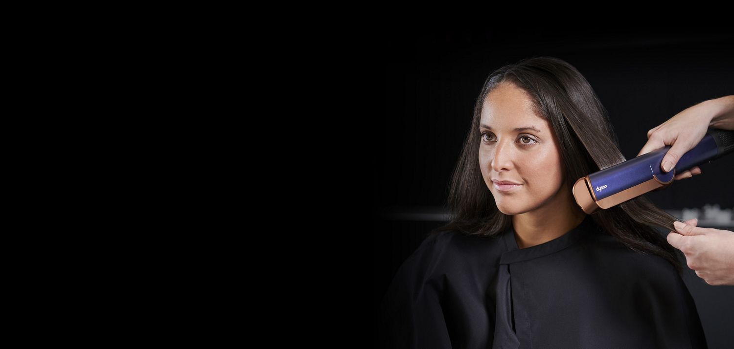 Women having her hair styled with Dyson hair care technology