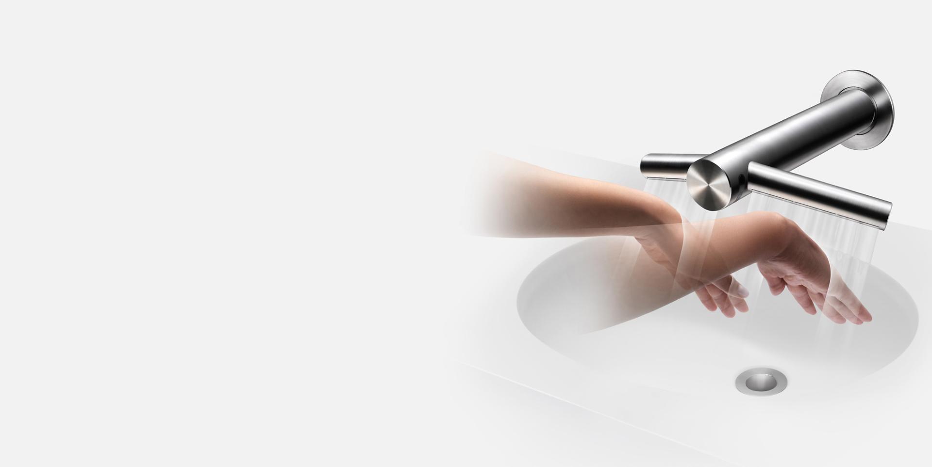 Hands beneath Dyson Airblade Wash+Dry hand dryer