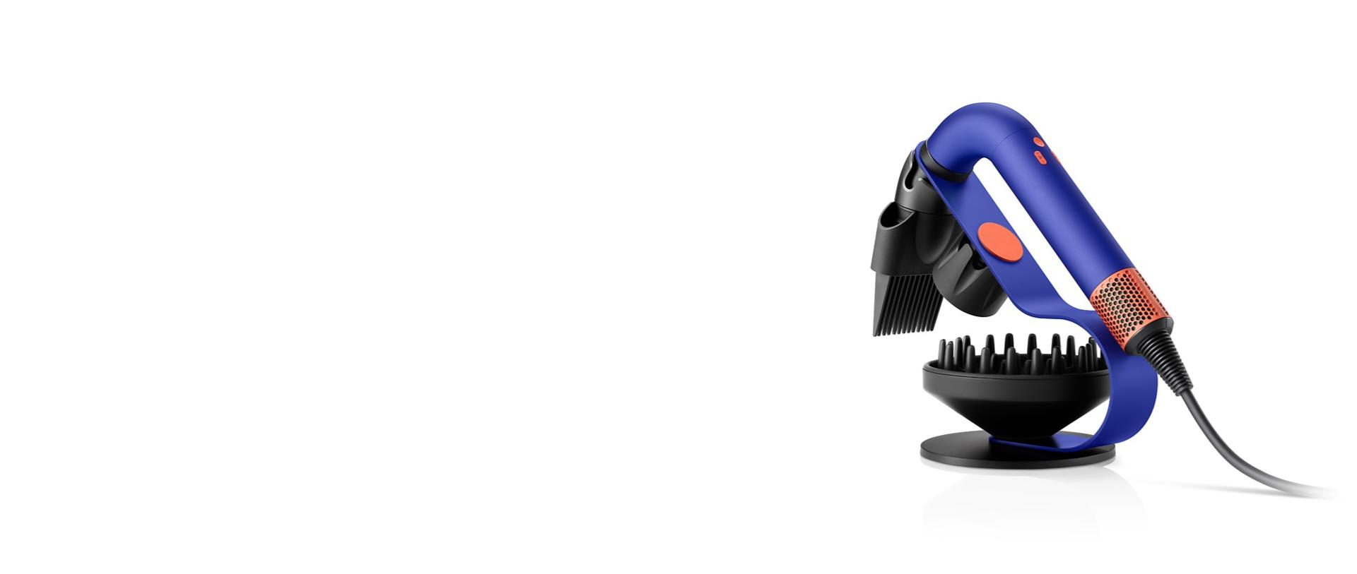 Dyson Supersonic r Professional hair dryer on the Display stand with the Flyaway attachment and Gentle air attachment.