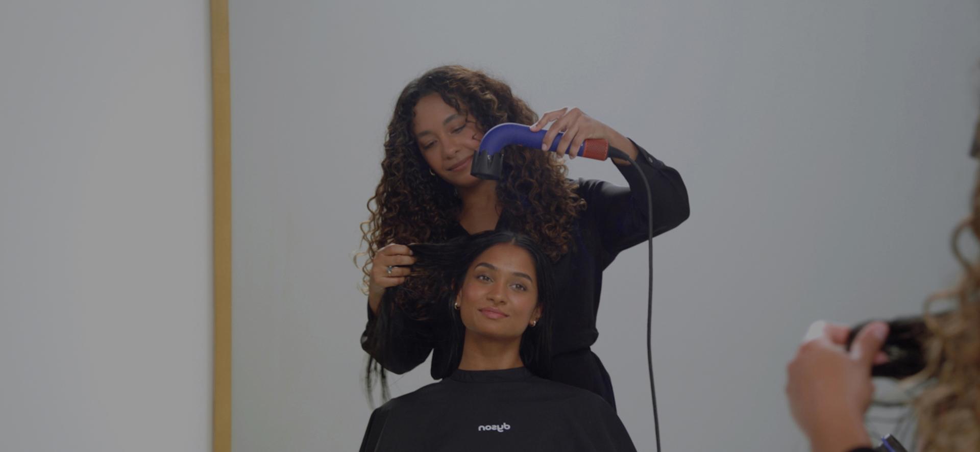 Dyson Global Styling Ambassador drying hair with the Dyson Supersonic r Professional hair dryer.