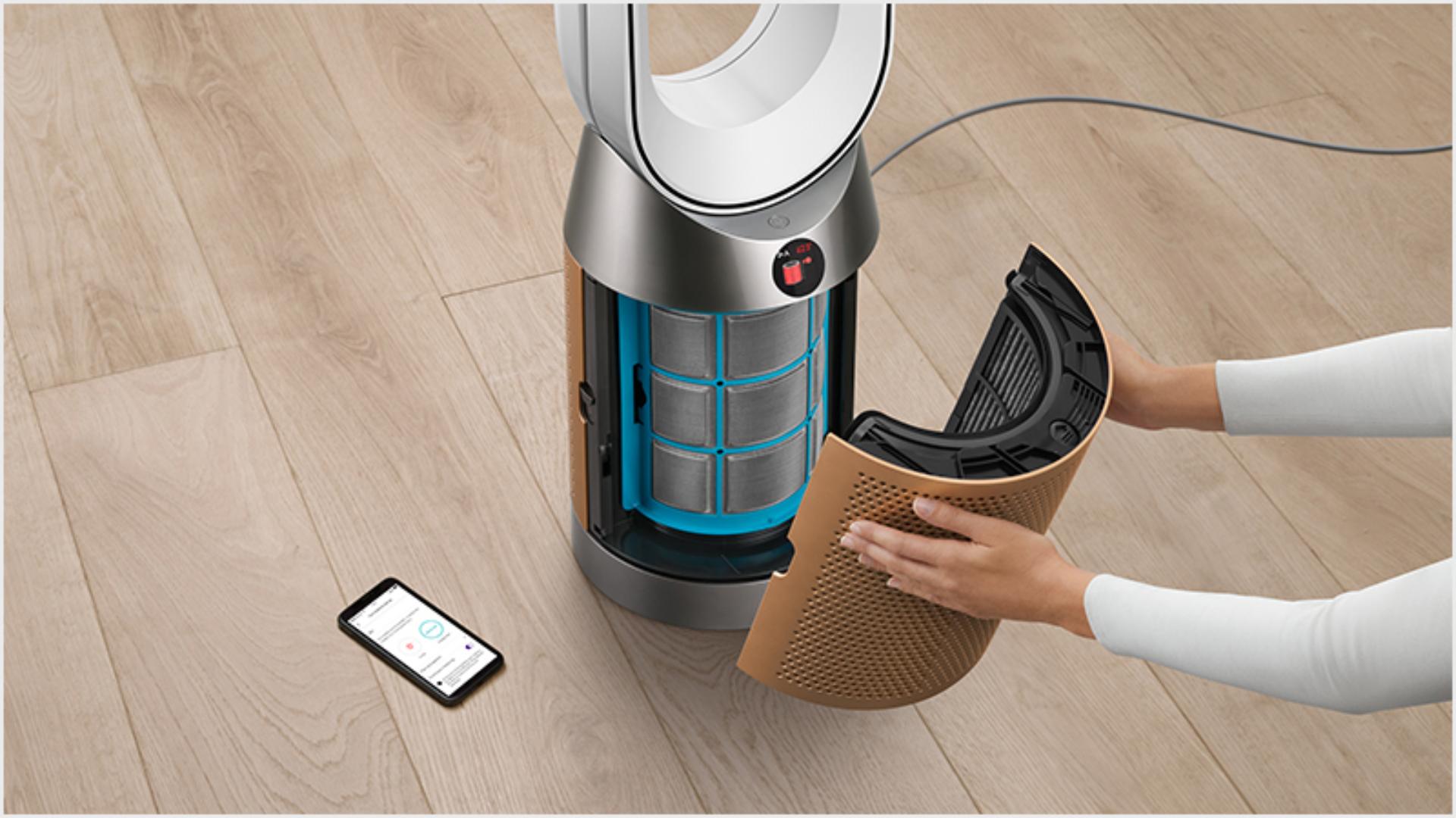 Someone changing a Dyson Purifier's filter