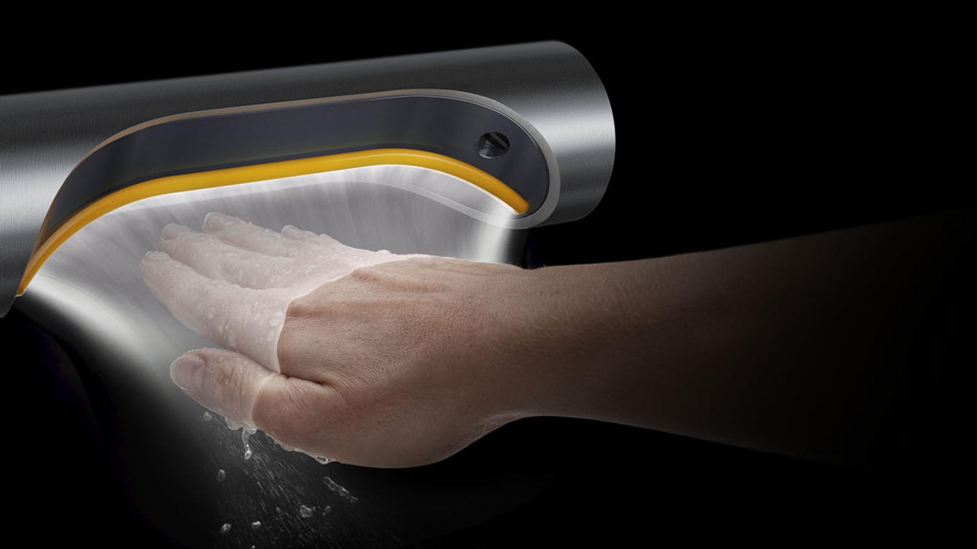 A hand held below a Dyson Airblade 9kJ hand dryer with an illustration to show how the air is propelled along the surface of the hand.