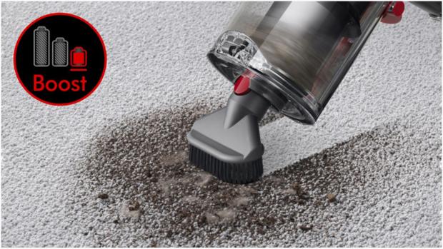 Dyson V11 as handheld picking up debris from carpet