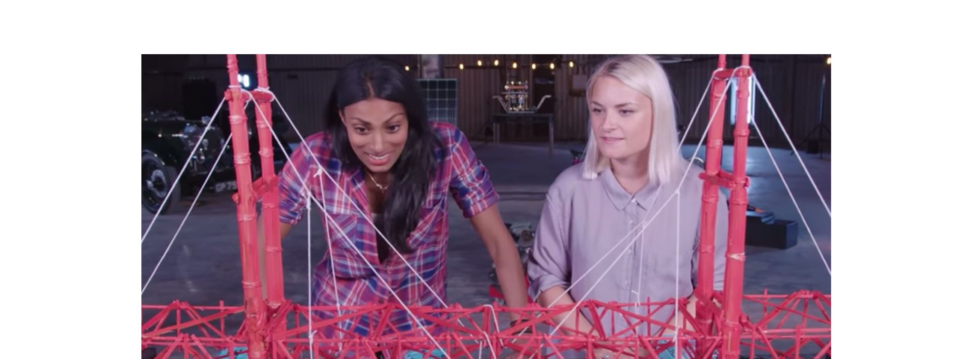 A Dyson engineer shows the spaghetti bridge challenge.