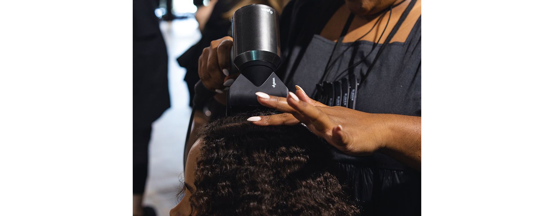Dyson supersonic being used on models hair