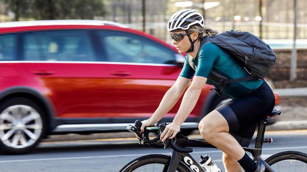 Annette Edmondson cycling with Dyson air quality backpack