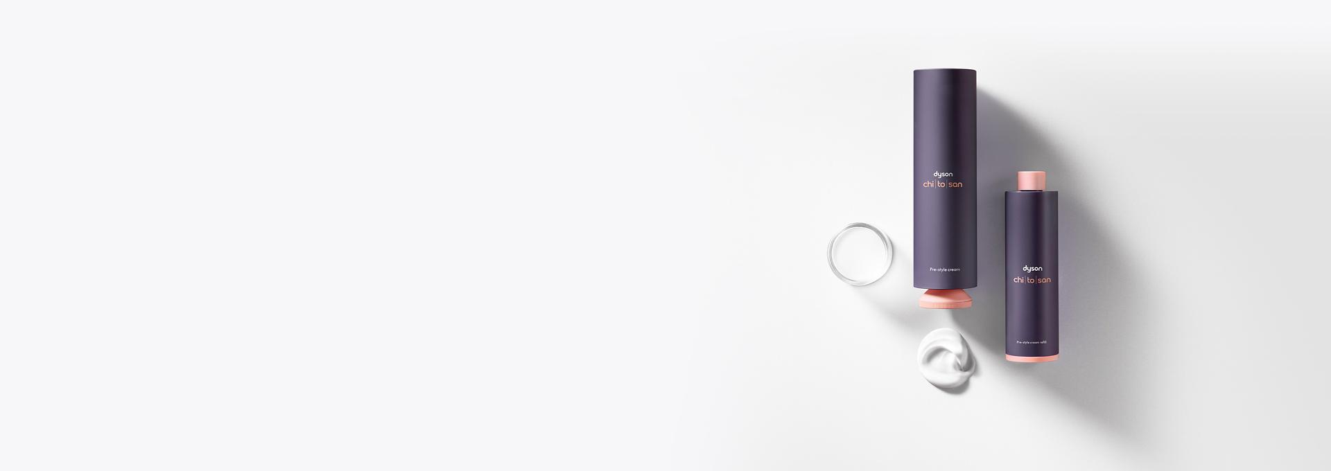 Dyson Chitosan Pre-style cream outer packaging and refill bottles next to each other