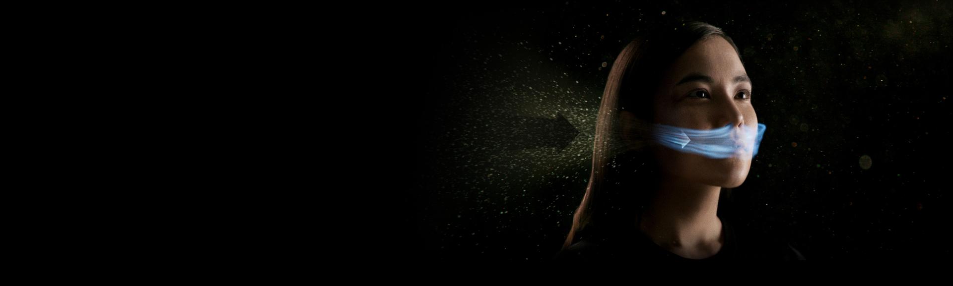 Woman with mysterious stream of air going into nose and mouth