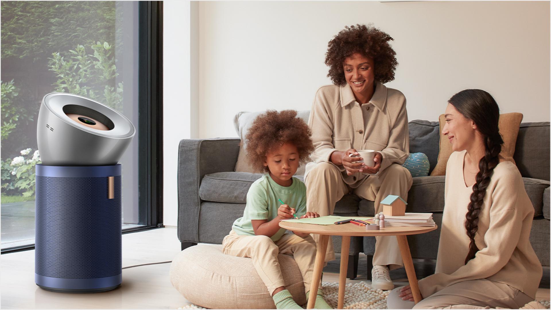 Family in living room with Big & Quiet purifier