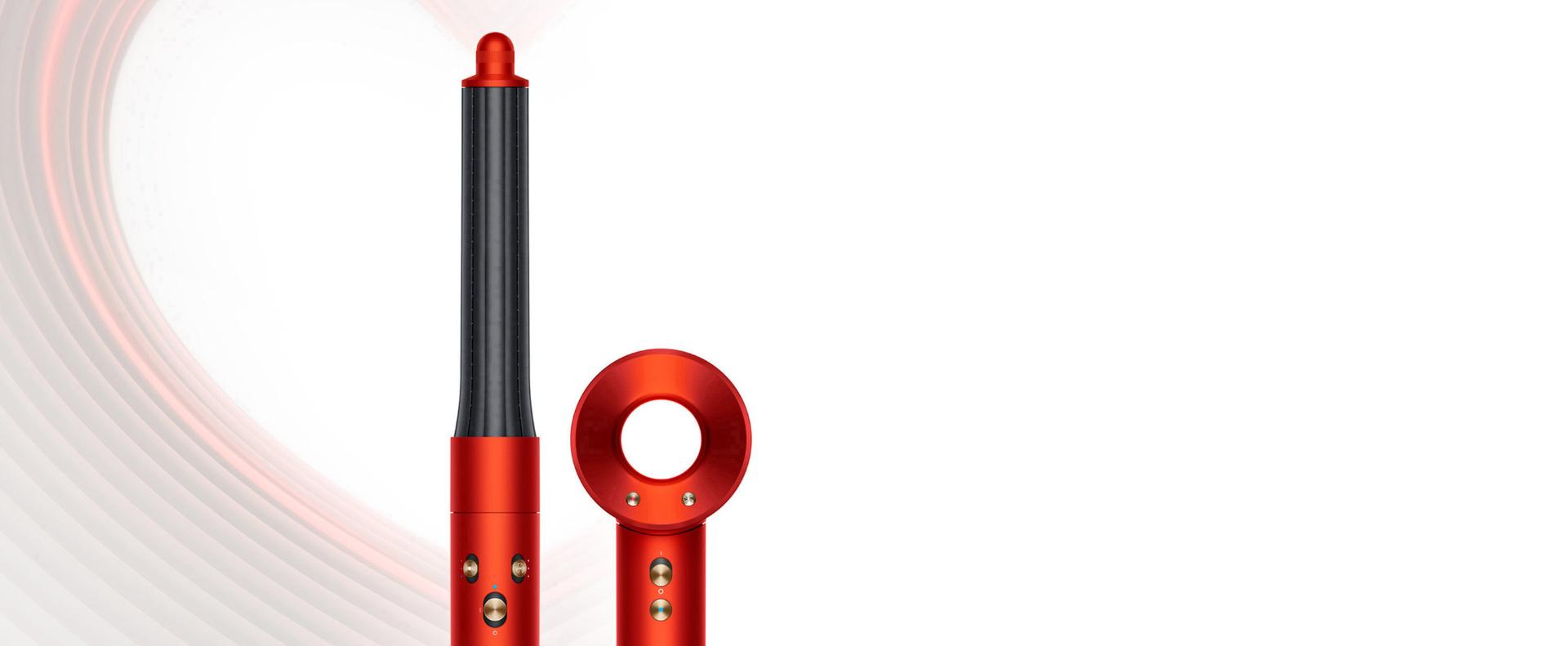 Dyson Supersonic and Dyson Airwrap Complete Long in Topaz orange, on a heart-design background.