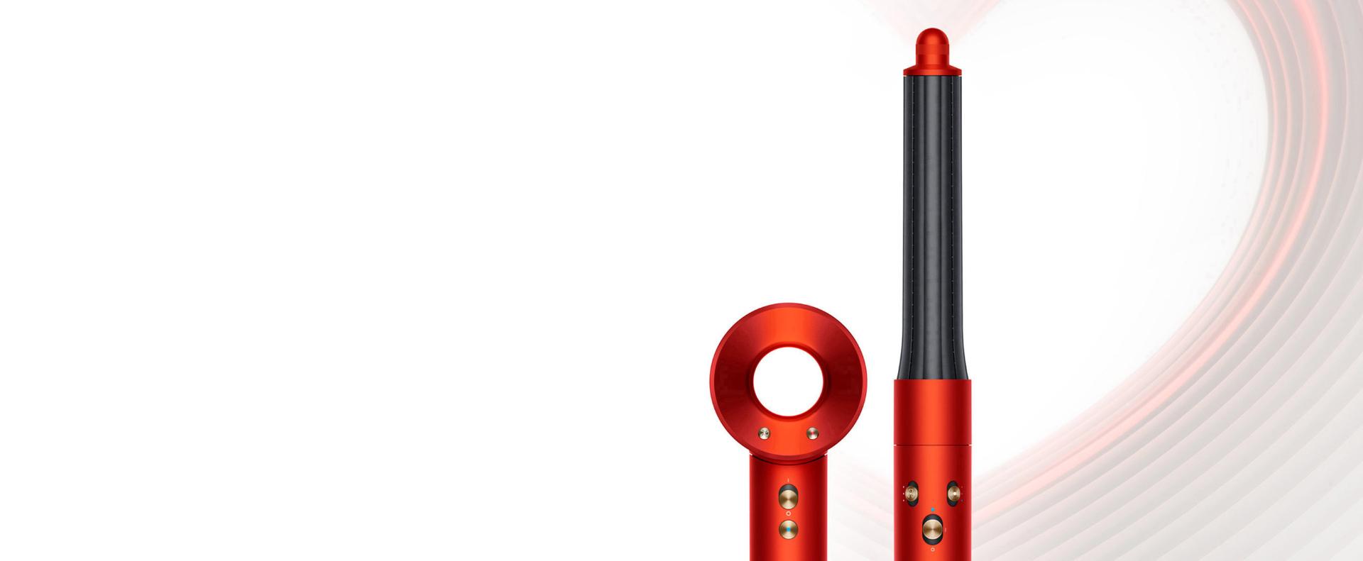 Dyson Supersonic and Dyson Airwrap Complete Long in Topaz orange, on a heart-design background.