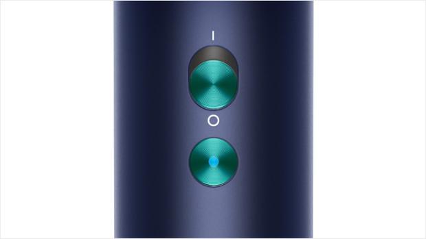 Close-up of the Dyson Supersonic hair dryer's cold shot button.