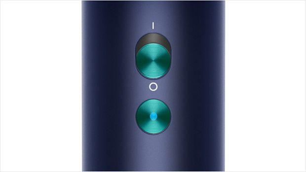 Close-up of the Dyson Supersonic hair dryer's cold shot button.