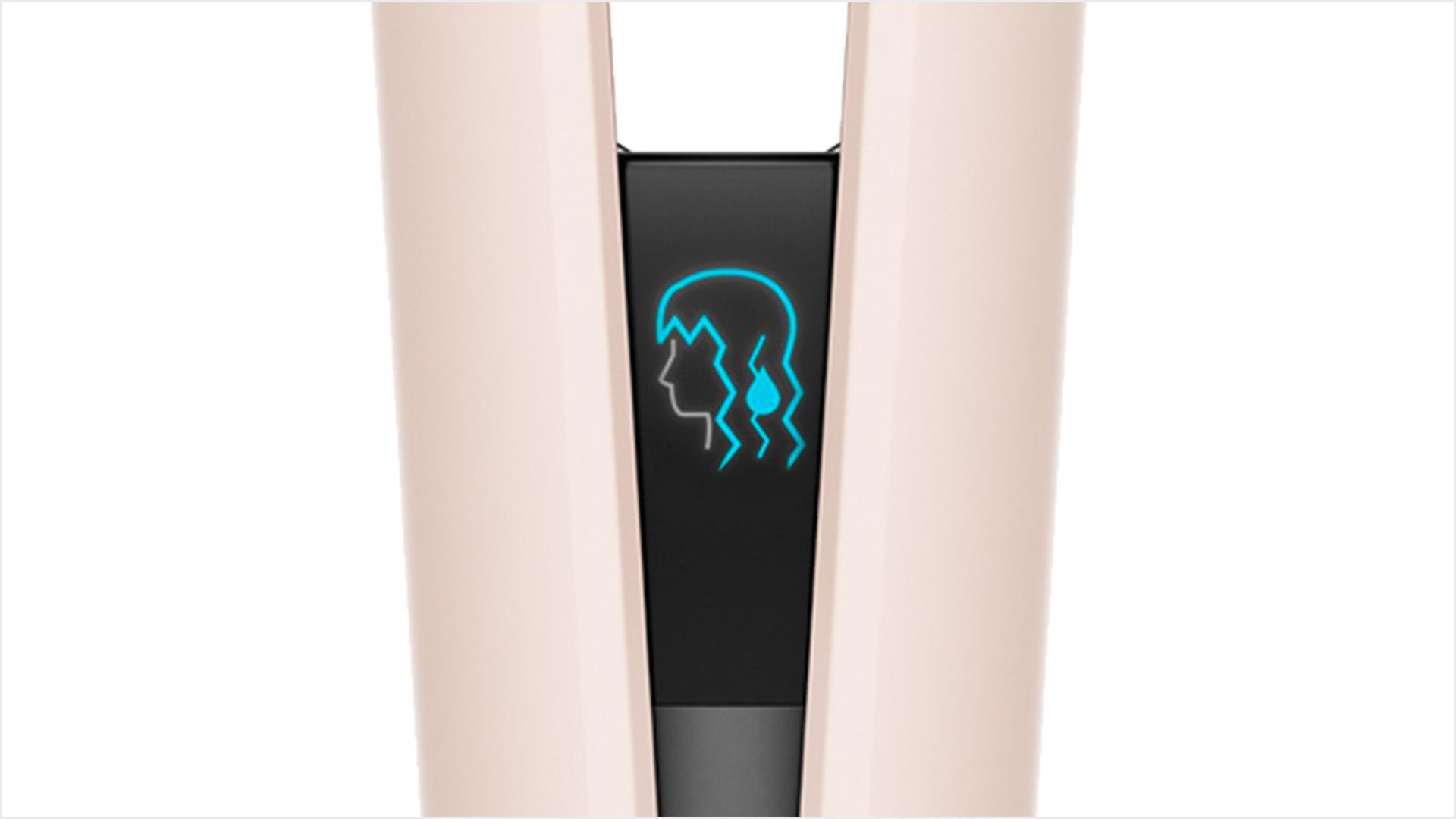 The LCD screen of the Dyson Airstrait straightener shows an icon of wet hair.