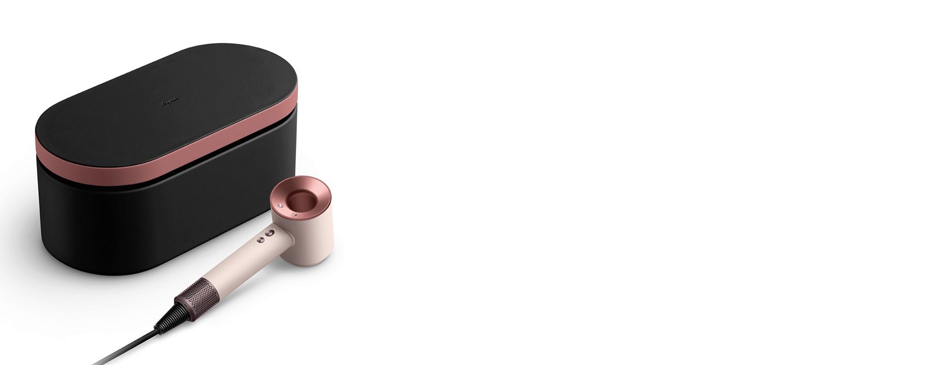 Dyson Supersonic hair dryer in Ceramic pink and rose gold and presentation case in Onyx rose gold.