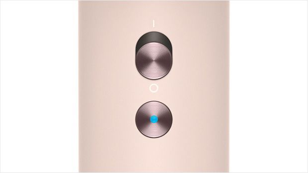 Close-up of the Dyson Supersonic hair dryer's cold shot button.