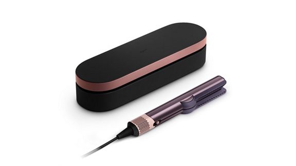 A Dyson Airstrait straightener and Presentation case in Jasper Plum.