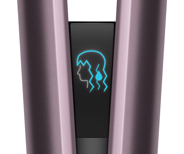 Close-up of the Dyson Airstrait's LCD screen showing the wet mode icon.