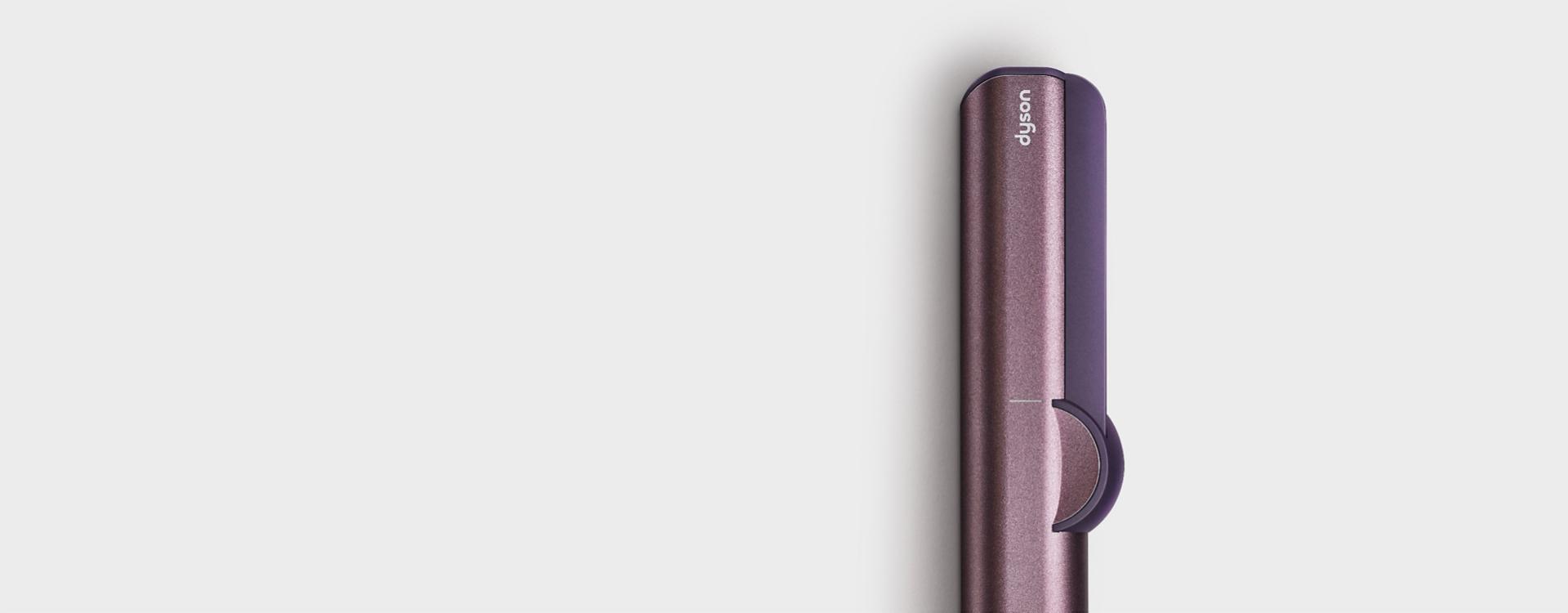 The Dyson Airstrait straightener in Jasper plum.