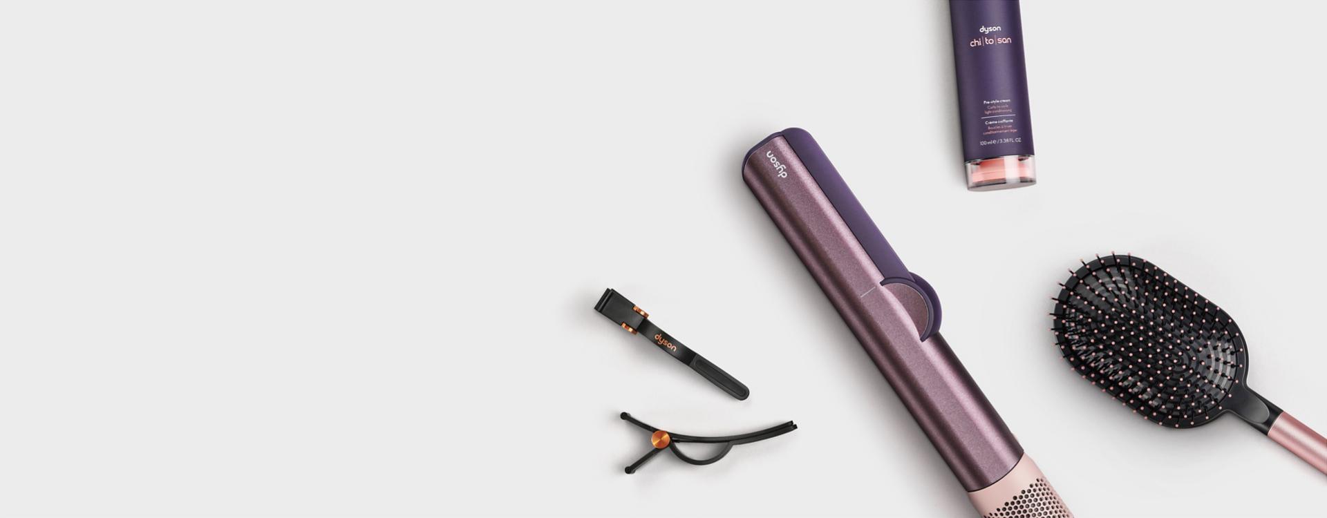 The Dyson Airstrait straightener in Jasper plum.