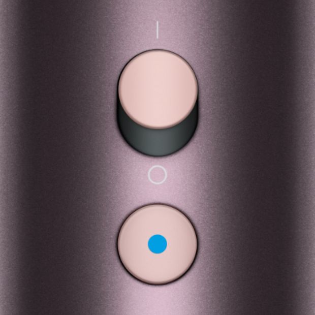 The power and Cold-shot buttons on the Dyson Supersonic Nural hair dryer.