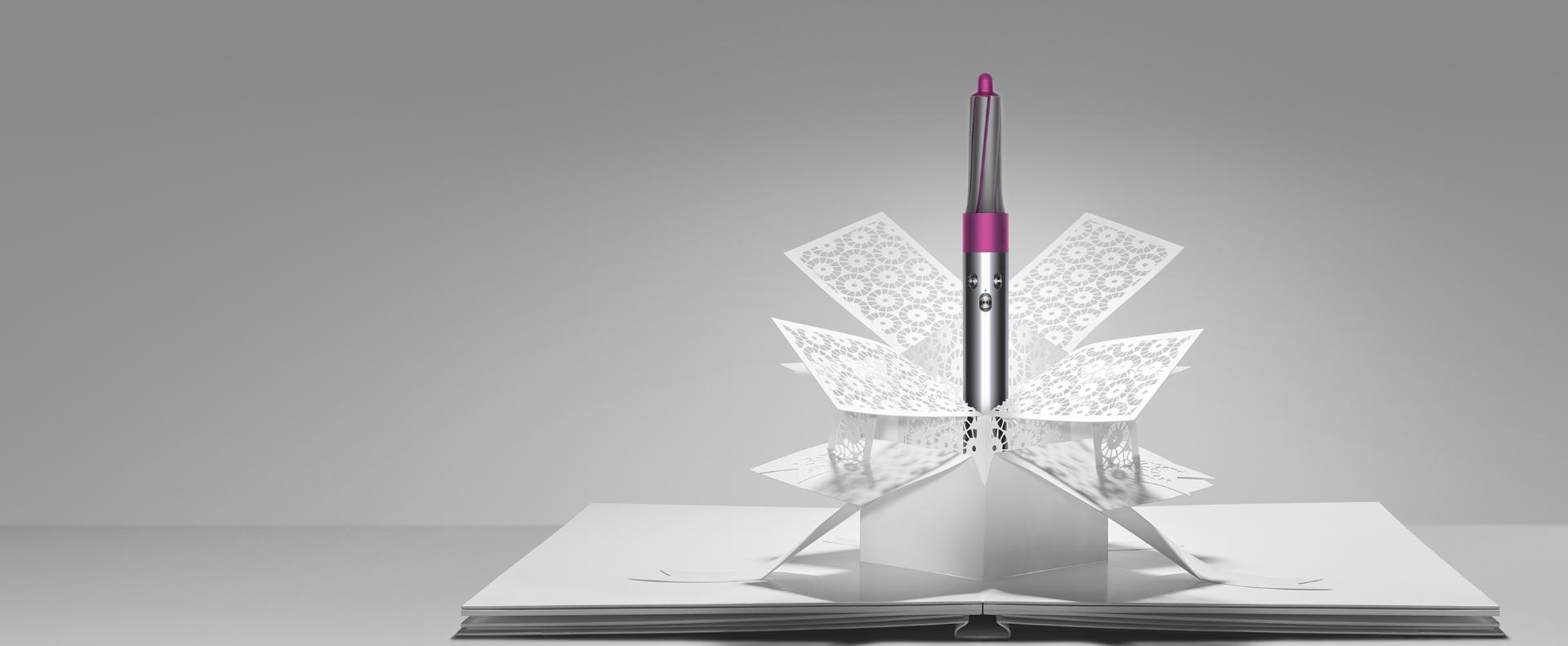 Dyson Airwrap™ styler emerging from paper art