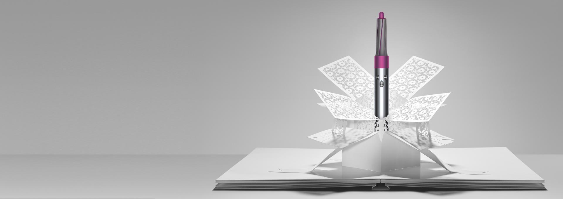 Dyson Airwrap™ styler emerging from paper art