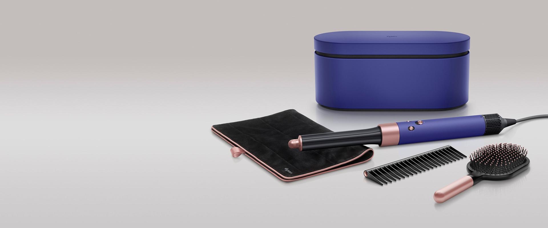Dyson Airwrap multi-styler in Vinca blue and Rosé with travel pouch, presentation case, detangling comb and paddle brush.