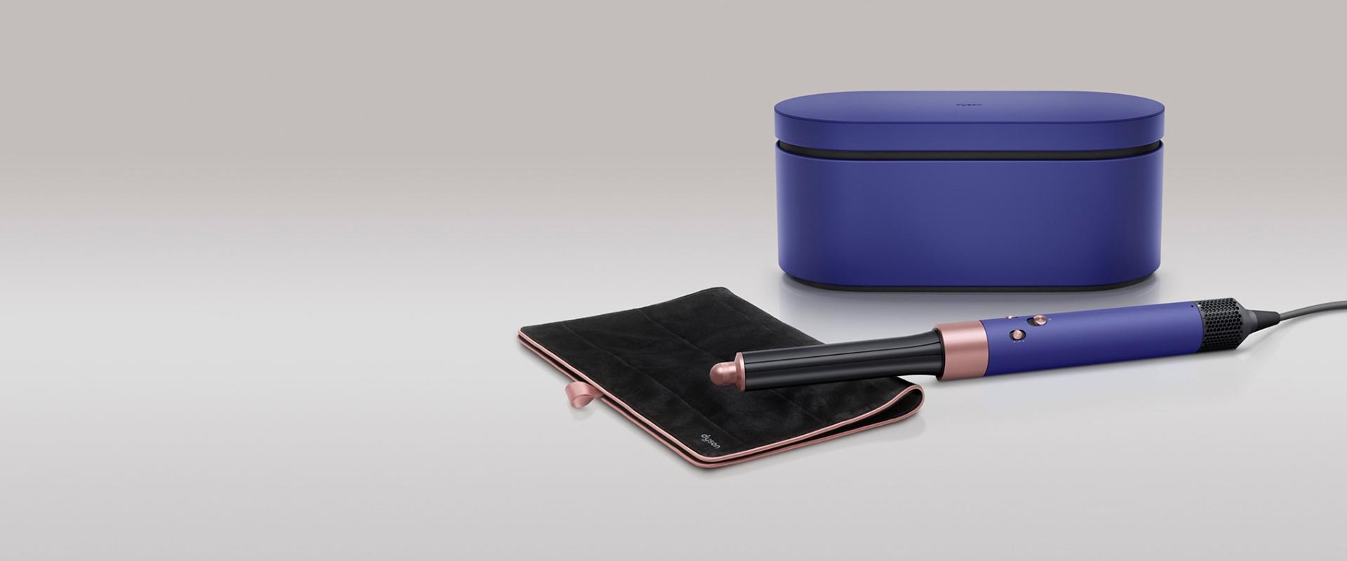 Dyson Airwrap multi-styler in Vinca blue and Rosé with travel pouch.