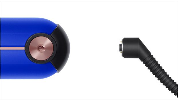 The Dyson Corrale straightener in its charging dock