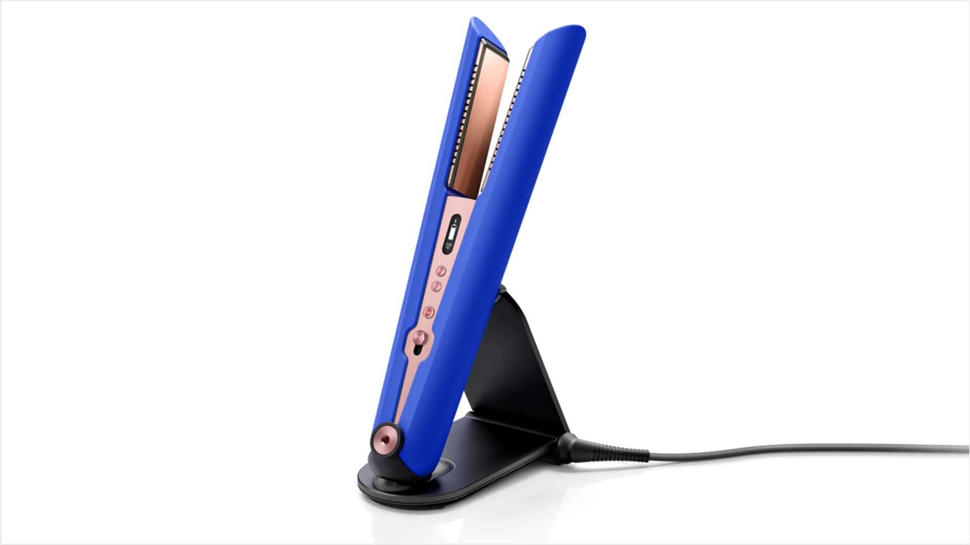 The Dyson Corrale straightener in its charging dock