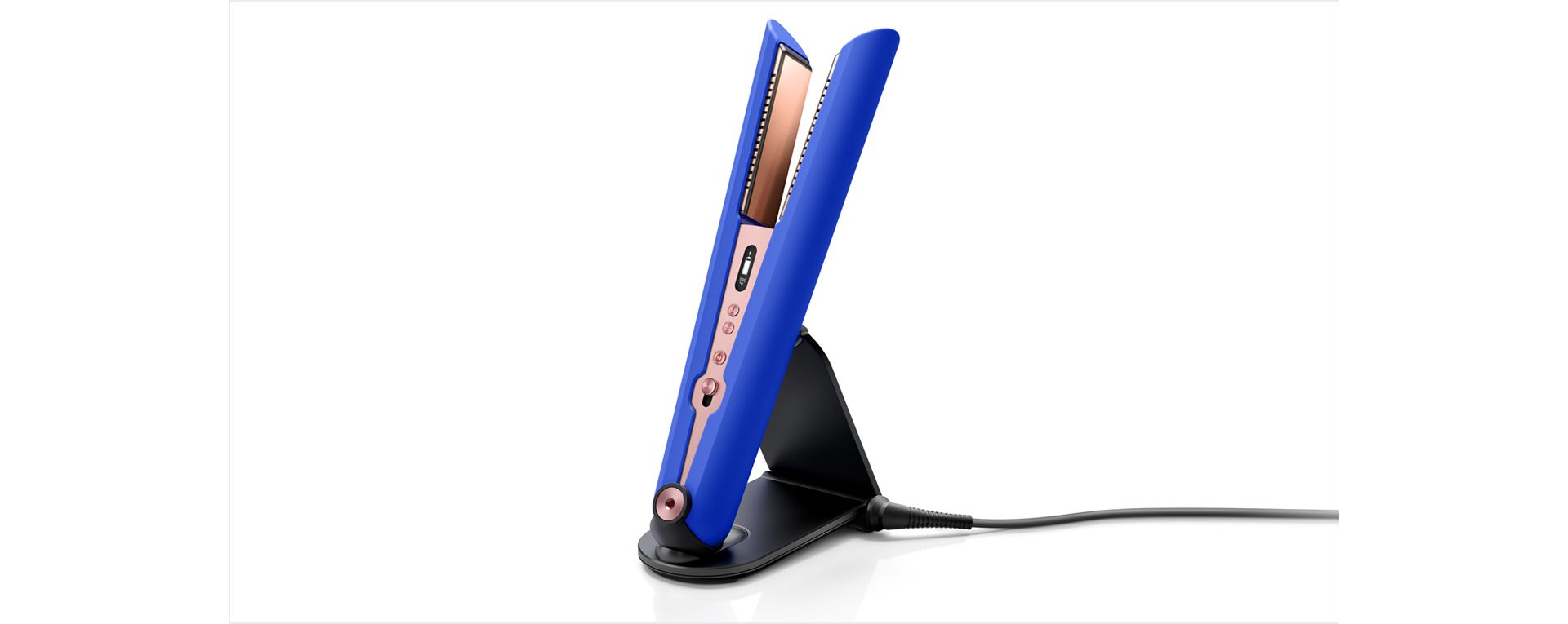 The Dyson Corrale straightener in its charging dock