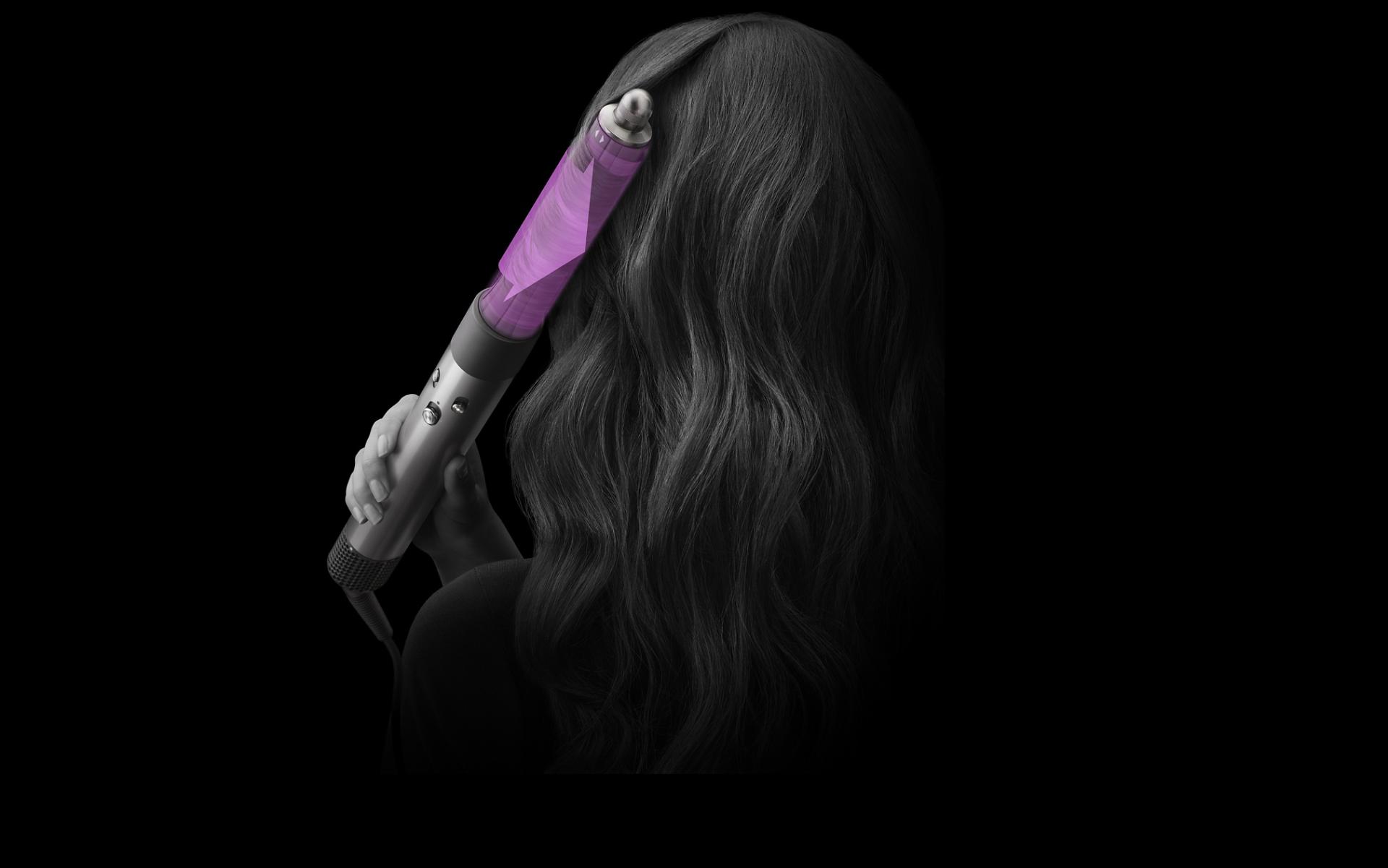 The Airwrap multi-styler and dryer being used to curl hair