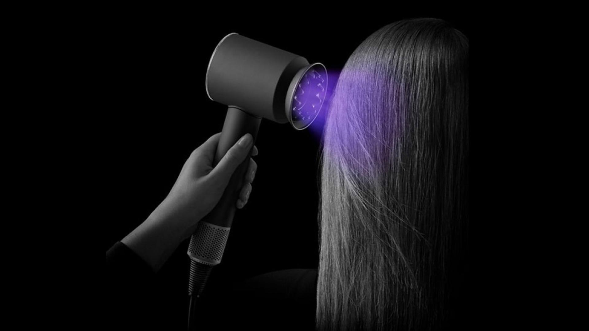 The Supersonic Nural hair dryer being used to dry hair