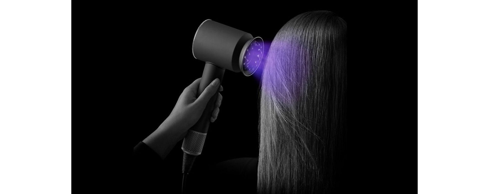 The Supersonic Nural hair dryer being used to dry hair 