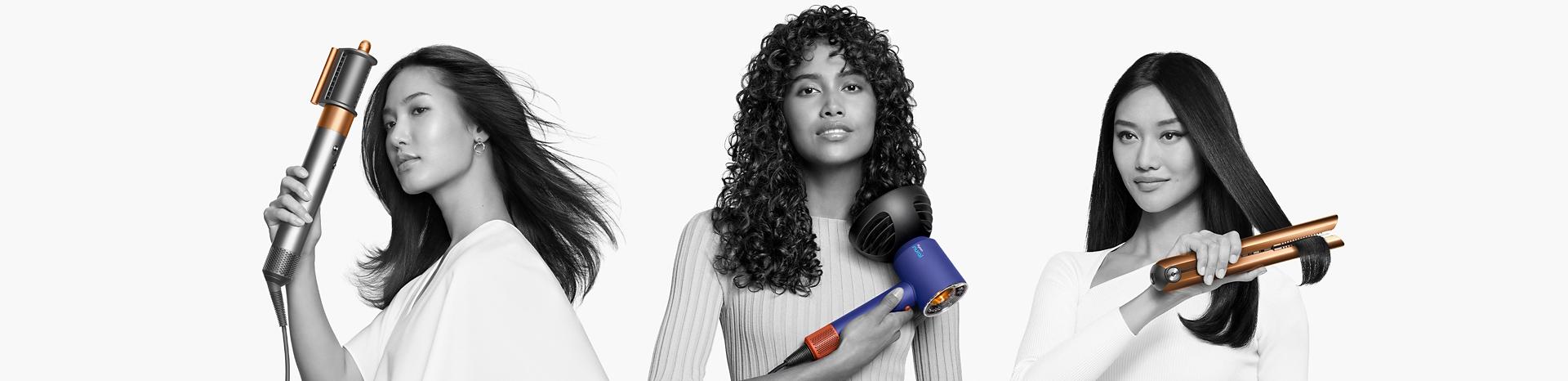 Models using the Dyson hair care range to dry or style their hair