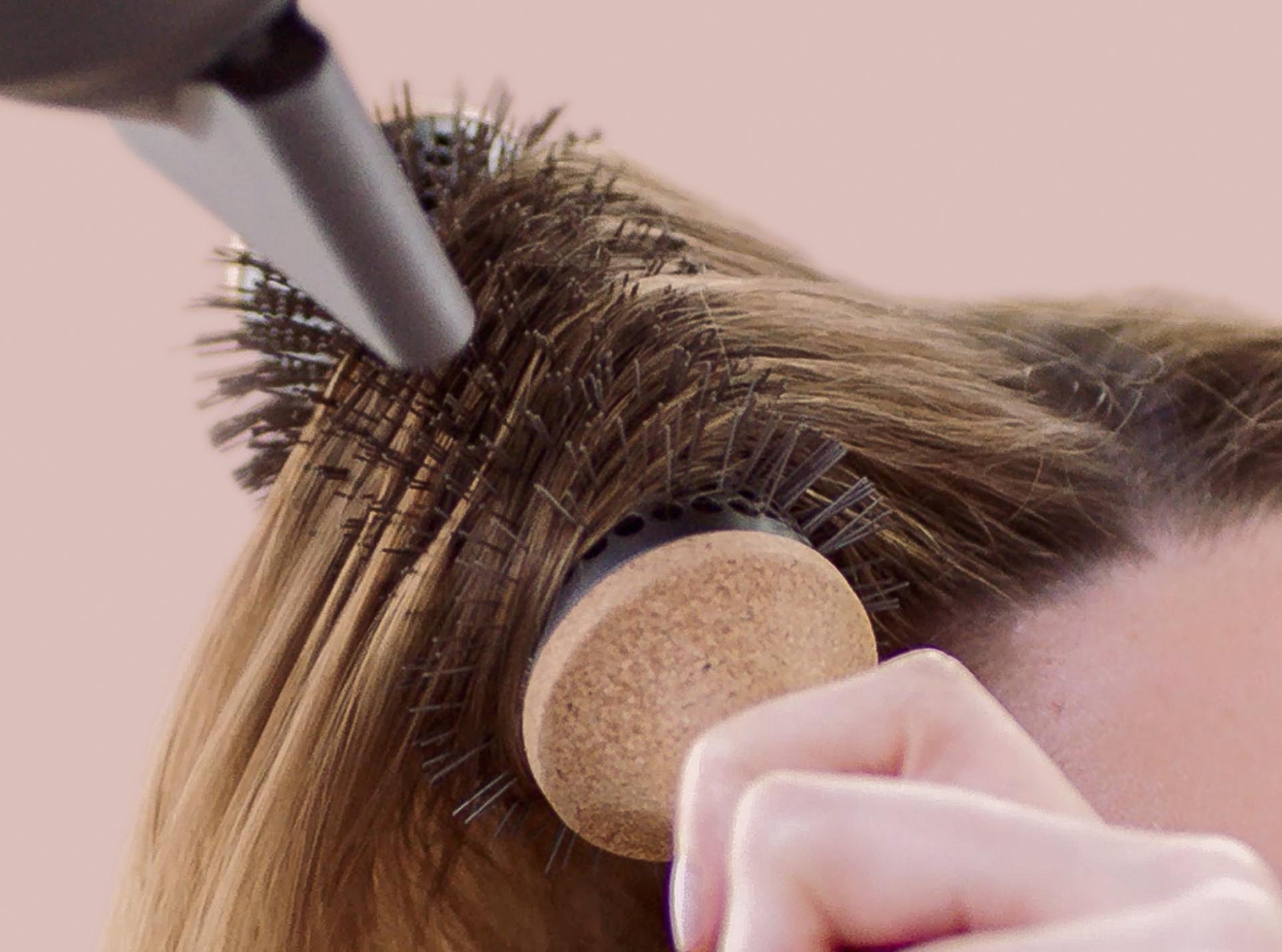 The Dyson Vented Barrel brush being used when drying the hair with the Dyson Supersonic hair dryer