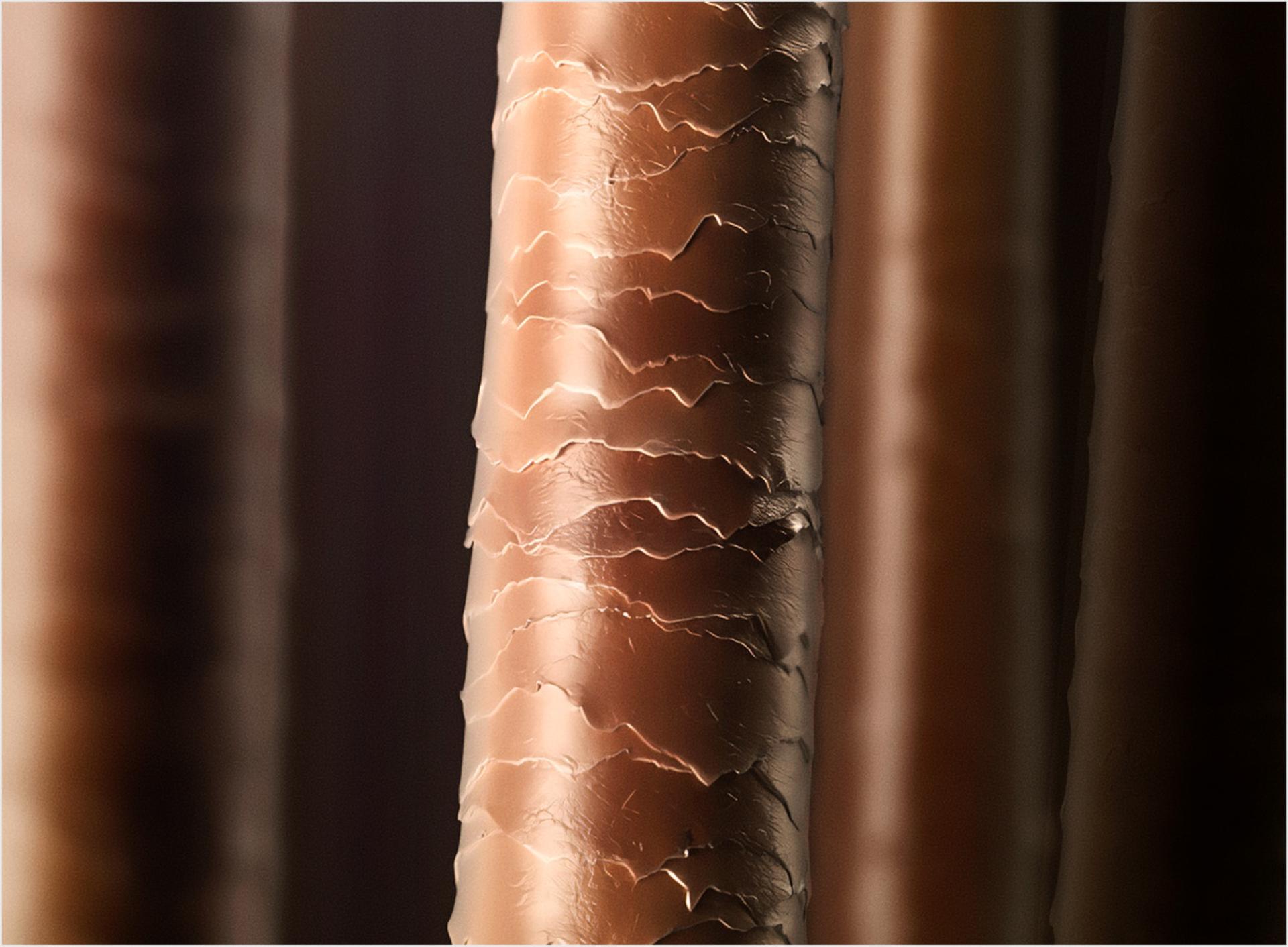 Close up of a healthy hair cortex coated which looks smooth and shiny