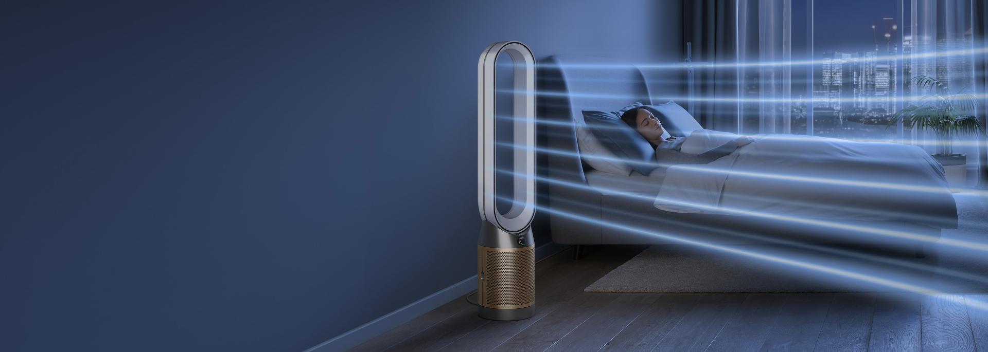 Dyson purifier in a dark bedroom with someone sleeping peacefully